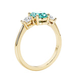 3 stone oval engagement ring with elegant proportions with paraiba green gemstone and diamond side stones.