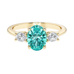 Oval 3 stone engagement ring with real paraiba tourmaline and brilliant diamond side stones.