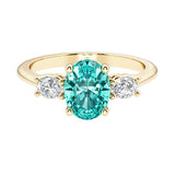 Oval 3 stone engagement ring with real paraiba tourmaline and brilliant diamond side stones.