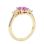 3 stone oval engagement ring with elegant proportions with pink gemstone and diamond side stones.