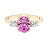 Oval 3 stone engagement ring with real pink sapphire and brilliant diamond side stones.