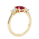 Oval 3 stone engagement ring with brilliant diamond side stones.