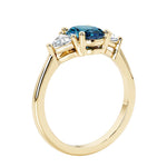 Oval 3 stone engagement ring with brilliant diamond side stones.