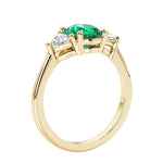 Oval 3 stone engagement ring with brilliant diamond side stones.