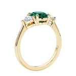 Oval 3 stone engagement ring with brilliant diamond side stones.
