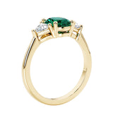 Oval 3 stone engagement ring with brilliant diamond side stones.