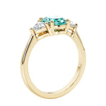 Oval 3 stone engagement ring with brilliant diamond side stones.