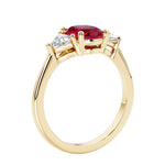 Oval 3 stone engagement ring with brilliant diamond side stones.