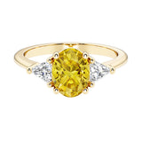 Oval cut three stone diamond engagement ring with romantic charm with yellow gemstone center 14k yellow gold