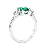 3 stone oval ring with gemstone and diamonds in sleek white gold.
