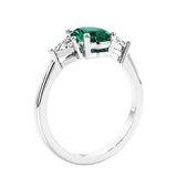 3 stone oval ring with gemstone and diamonds in sleek white gold.