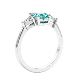 3 stone oval ring with gemstone and diamonds in sleek white gold.