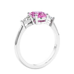3 stone oval ring with gemstone and diamonds in sleek white gold.