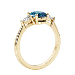 Oval 3 stone engagement ring with gemstone brilliant diamond side stones.