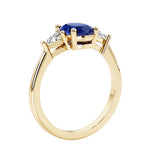 Oval 3 stone engagement ring with gemstone brilliant diamond side stones.