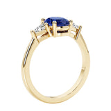 Oval 3 stone engagement ring with gemstone brilliant diamond side stones.