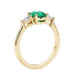 Oval 3 stone engagement ring with gemstone brilliant diamond side stones.