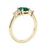 Oval 3 stone engagement ring with gemstone brilliant diamond side stones.