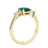 Oval 3 stone engagement ring with gemstone brilliant diamond side stones.