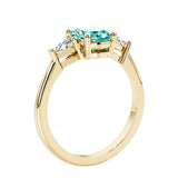 Oval 3 stone engagement ring with gemstone brilliant diamond side stones.