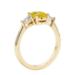 Oval 3 stone engagement ring with gemstone brilliant diamond side stones.