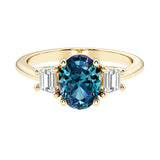 3 stone oval engagement ring with elegant proportions with gemstone and diamonds.