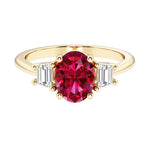 3 stone oval engagement ring with elegant proportions with red gemstone and diamonds.