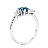 3 stone diamond engagement ring with pear shaped center in white gold.