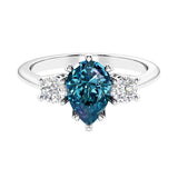 3 stone pear diamond ring set in a delicate band.