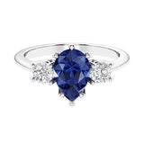Blue Sapphire 3 stone pear diamond ring set in a delicate band.