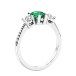 3 stone diamond engagement ring with pear shaped center in white gold featuring Colombian Green Emerald.
