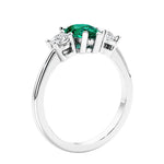 3 stone diamond engagement ring with pear shaped center in white gold featuring Green Emerald.