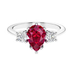 Ruby 3 stone pear diamond ring set in a delicate band.