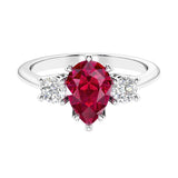 Ruby 3 stone pear diamond ring set in a delicate band.
