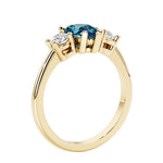 Three stone pear shaped engagement ring with classic styling.
