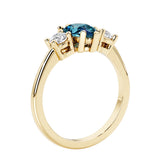 Three stone pear shaped engagement ring with classic styling.