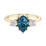 Pear shaped 3 stone engagement ring with elegant diamond side stones.