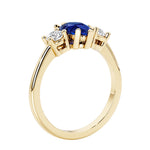 Blue Sapphire three stone pear shaped engagement ring with classic styling.