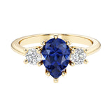 Blue Sapphire pear shaped 3 stone engagement ring with elegant diamond side stones.