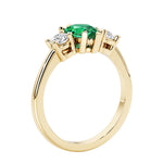 Colombian Green Emerald three stone pear shaped engagement ring with classic styling.