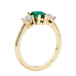 Green Emerald three stone pear shaped engagement ring with classic styling.
