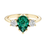 Green Emerald pear shaped 3 stone engagement ring with elegant diamond side stones.