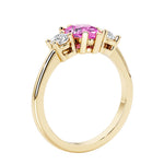 Pink Sapphire three stone pear shaped engagement ring with classic styling.