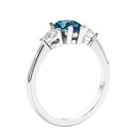 3 stone diamond engagement ring with pear shaped center in white gold featuring Color changing alexandrite.