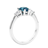 3 stone diamond engagement ring with pear shaped center in white gold featuring Color changing alexandrite.