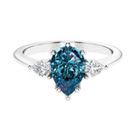 Color changing alexandrite 3 stone pear diamond ring set in a delicate band.
