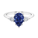 Blue Sapphire 3 stone pear diamond ring set in a delicate band.
