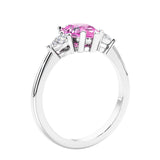 3 stone diamond engagement ring with pear shaped center in white gold featuring Pink Sapphire.