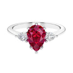 Red Ruby 3 stone pear diamond ring set in a delicate band.
