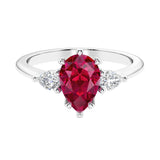Red Ruby 3 stone pear diamond ring set in a delicate band.